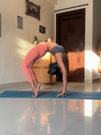 Creating shapes with the body. A beautiful Wheel Pose on tiptoes, which adds an extra challenge for the legs.