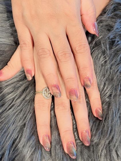 A multi-tonal cat eye effect with shades of pink, gold, and grey, creating a beautiful, shimmering dimension.