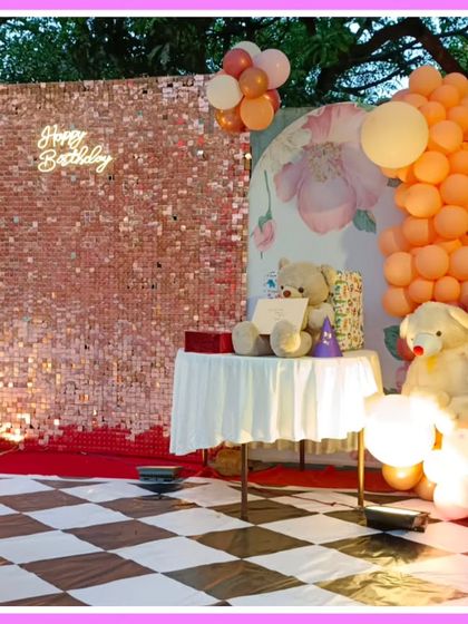 A teddy bear-themed first birthday with a rose gold sequin wall and a checkered floor.