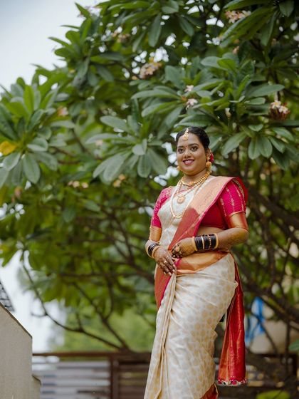 A duplicate of ID 21, this portrait shows a bride on her muhurtham day, smiling warmly.