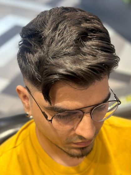 A front-on view of the styled men's haircut, showing how it frames the face.