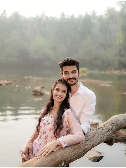 Posing on a fallen log over the river. Using natural elements in the environment helps create unique and authentic photographs.