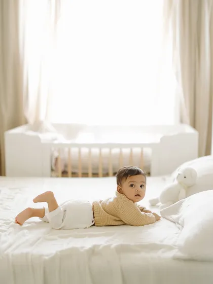 My son Caden at his 5-month milestone, captured in the warmth of our home. At-home sessions are perfect for capturing babies in their most comfortable and natural environment.