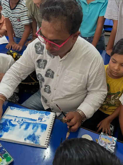 Here I am giving one on one guidance to a student during a watercolor session at our Gogamukh College workshop. Personal attention helps build confidence.