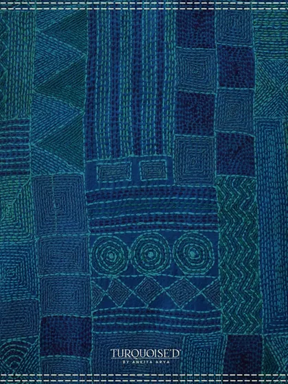 This image showcases the texture and geometry of traditional Kantha embroidery. The dense, running stitches in shades of blue create a beautiful, tactile surface that directly inspires the patterns in my Sundarban collection.