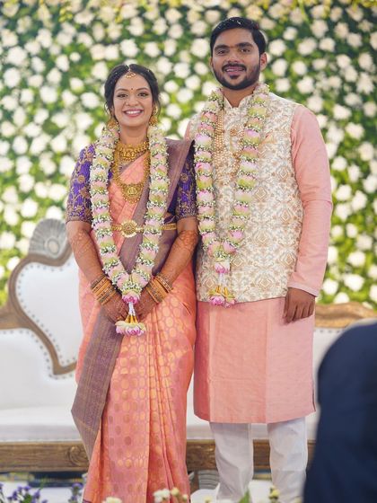 The couple posing for a portrait. The bride's makeup is perfectly balanced, enhancing her features while maintaining a natural and elegant feel.
