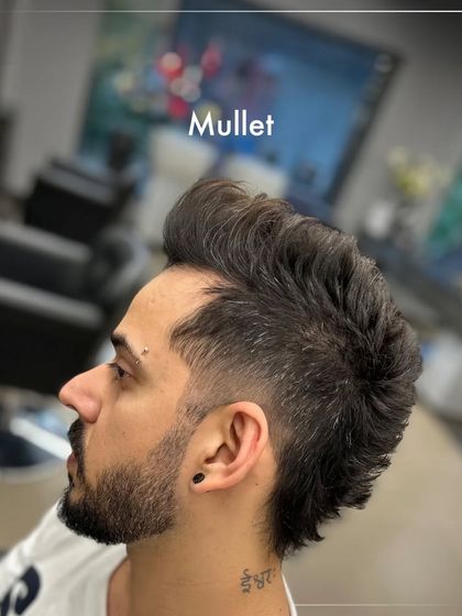The mullet is back and more stylish than ever. This modern take features a sharp fade on the sides, blending into a longer length at the back for a bold, fashion-forward statement.