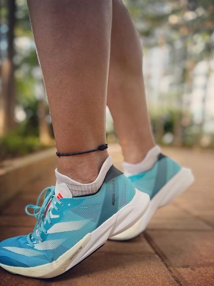 A close-up of my Adizero shoes, ready for a run. The right gear can make a huge difference in your training and racing.