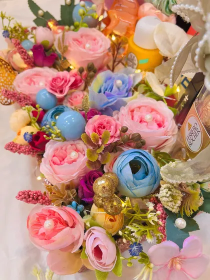 Another angle of the vibrant floral hamper, showing the rich textures and colors of the blooms. This is for the person who deserves a whole garden of love.