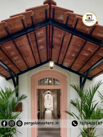 We blend traditional aesthetics with modern engineering. This entrance pergola features classic Mangalore tiles, offering natural cooling and timeless charm that adds a touch of heritage and elegance to the home's facade.