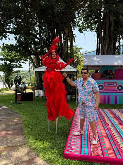 With a stilt walker at a Goa carnival. The entertainment is always larger than life at my events.