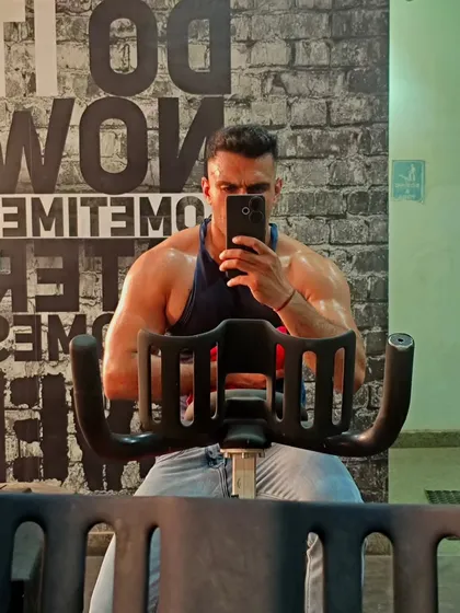 Even a cardio session on the spin bike is an opportunity to check your progress. Maintaining muscle definition while improving stamina is a key part of my training philosophy.