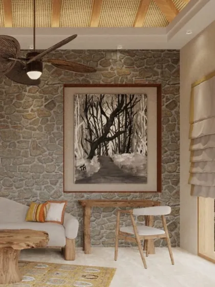 A closer look at the living room in a Dev Villa. The space is furnished with natural materials, including a unique wooden coffee table and a leaf-shaped ceiling fan, enhancing the eco-friendly theme.