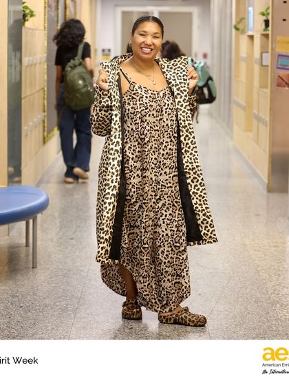 A teacher shows off her full leopard-print outfit for 'animal day' during Middle School Spirit Week. Our faculty's enthusiastic participation makes these events even more memorable for students.
