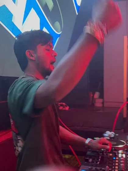 Caught in the moment, singing along and pumping up the crowd during a high-intensity part of my set.