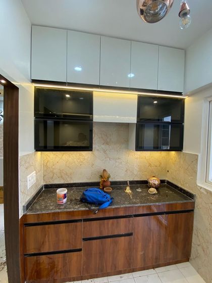 Another view of the dual-finish kitchen, showing the placement of the hob and chimney.
