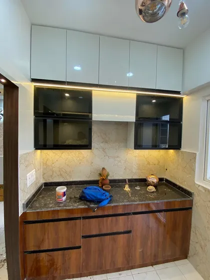 Another view of the dual-finish kitchen, showing the placement of the hob and chimney.