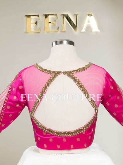 A closer look at the craftsmanship of this pink pure silk blouse. It features intricate handwork with bead detailing on the neckline and delicate net sleeves with linear embroidery for a touch of grace.