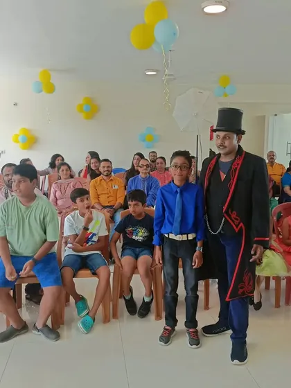 Posing with the birthday boy and his friends. It's great to see the kids still buzzing with excitement after the magic show has ended.