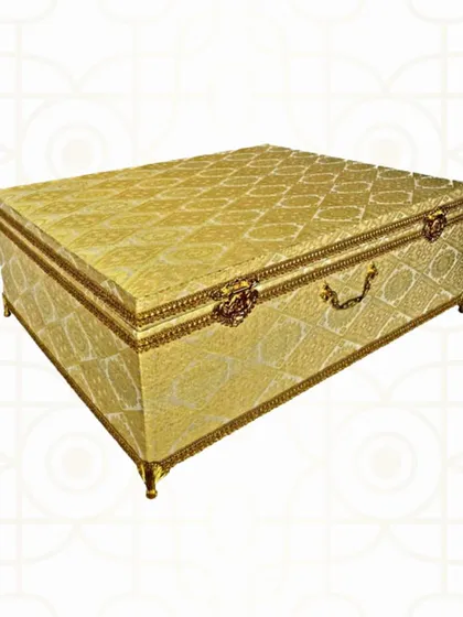 An example of pure luxury, this golden brocade trousseau box is designed for the bride with classic taste. The intricate fabric and antique-finish hardware make it a true heirloom piece.