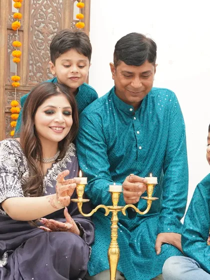 A traditional family portrait celebrating Diwali. We capture the warmth and light of the festival as the family shares a special moment together.