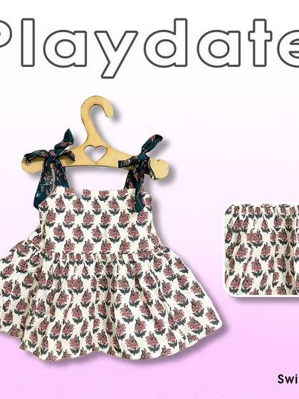 This floral top and shorts set is perfect for a playdate. The design is cute and practical, allowing for easy movement while looking adorable.
