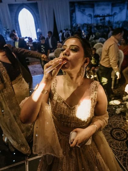 A guest enjoying a drink and the music on a packed dance floor. Our goal is to make sure everyone can let loose and have a great time.