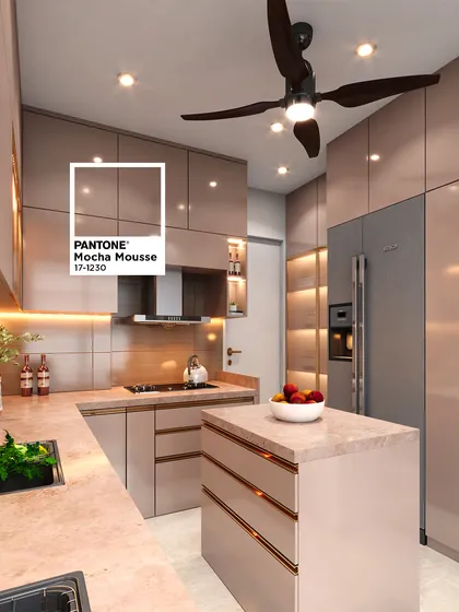 Explore the warmth of 'Mocha Mousse', Pantone's Color of the Year 2025. This kitchen showcases the color in high-gloss cabinetry, paired with a beautiful marble-finish countertop on the island and main counters, creating a space that feels both luxurious and comforting.