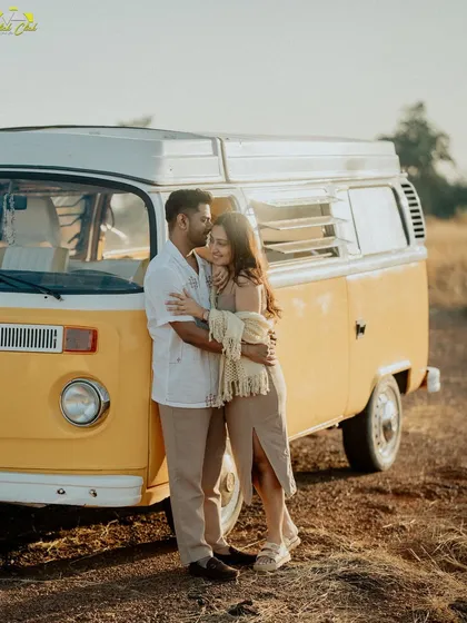 A warm, sun-kissed embrace against a classic yellow camper van in Goa. This shot perfectly captures the free-spirited, adventurous vibe of the shoot.