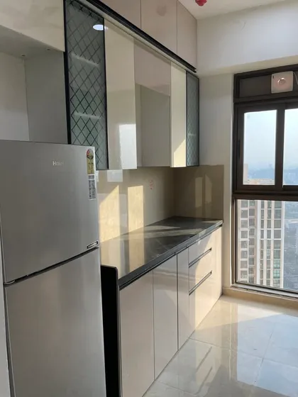Another angle showing the efficient use of space, with patterned glass cabinets adding a decorative touch.