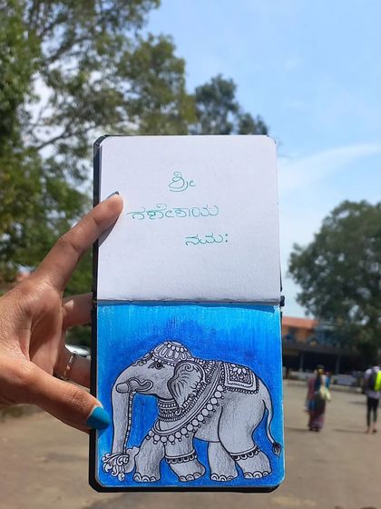 A sketch of a decorated temple elephant, inspired by my visit to the Anegudde Vinayaka Temple. The drawing is held up at the location, connecting the art to its source of inspiration.