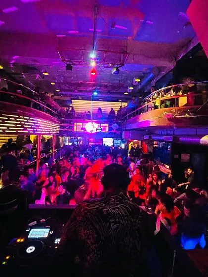 A wide shot of the club during one of my sets. The entire venue, from the floor to the balconies, is packed and moving. This is the goal for every party.