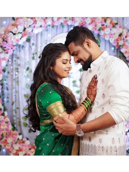 An intimate and romantic portrait of the newly engaged couple, surrounded by beautiful floral decor.