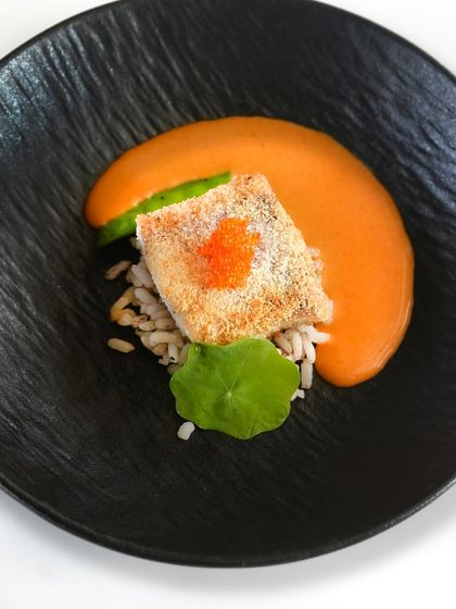 A beautiful plate of crispy sea bass served on a bed of red rice with a smoked chili curry. This dish was part of our special Valentine's menu, crafted for a romantic journey of flavours.