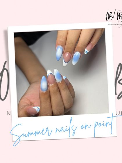When your nails match the summer sky. This dreamy set features a blue and white ombre effect, reminiscent of clouds, with a modern French tip design.