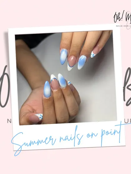 When your nails match the summer sky. This dreamy set features a blue and white ombre effect, reminiscent of clouds, with a modern French tip design.