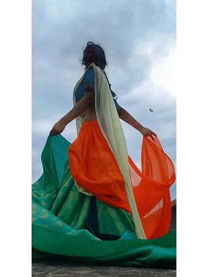 For my Independence Day shoot, I used the flow and drape of different colored fabrics to represent the Indian flag. This shot captures the movement and spirit of the concept.