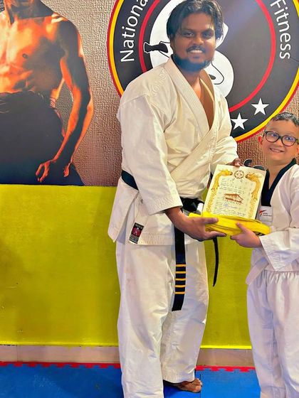 National Martial Arts and Fitness Academy - Kids Martial Arts & Fitness The Journey of Discipline: Belt Graduations photo 14