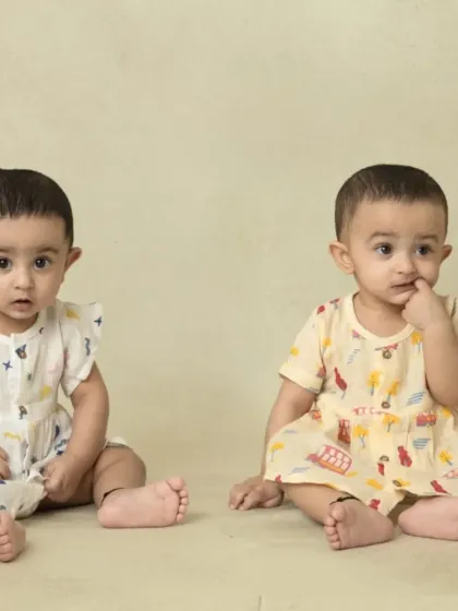 A collection of simple, classic portraits of twin babies. Without props or themes, their individual expressions and connection are beautifully highlighted.
