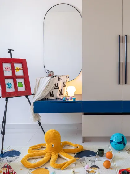 I call this "ordered chaos". For this kids' room, we focused on creating a furniture-free space that encourages play. The storage is minimal and efficient, designed to hold all the toys you see on the floor. A room should invite you to live in it, and sometimes the most beautiful design is the mess your kids make while playing.