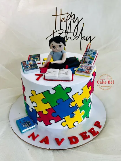 Another angle of the puzzle and mythological books cake.