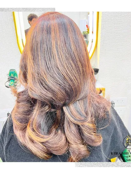 Look at the rich dimension in this hair color. By blending different tones of brown and caramel, I created a multi-dimensional look that appears full of life and movement.