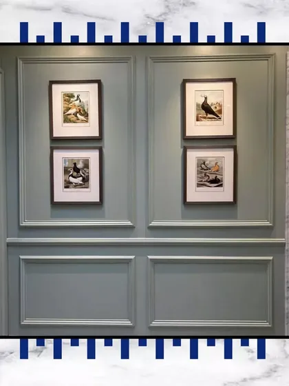 Wall paneling isn't just a detail; it's a canvas. Here, we've used a soft green-grey paneling to create a feature wall, perfect for displaying art and adding a touch of personalized elegance.
