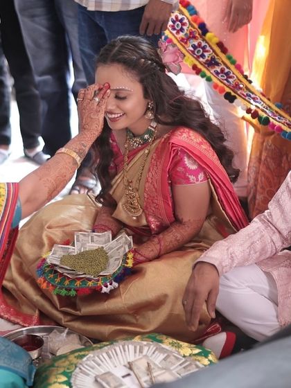 Another angle of the Ganesh Poojan, showing the bride's happy and serene expression.