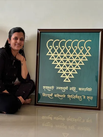 Taking a moment to appreciate the final product. This large Saraswati frame is a labor of love, from design to the final touch.