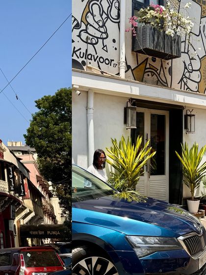 The vibrant street art and murals of Kala Ghoda, seen here on the facade of a building next to a striking blue car.