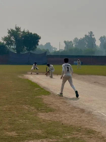 The bowlers celebrate an early breakthrough.