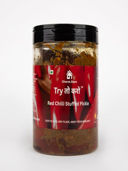 A larger jar of Red Chilli Stuffed Pickle on a white background.