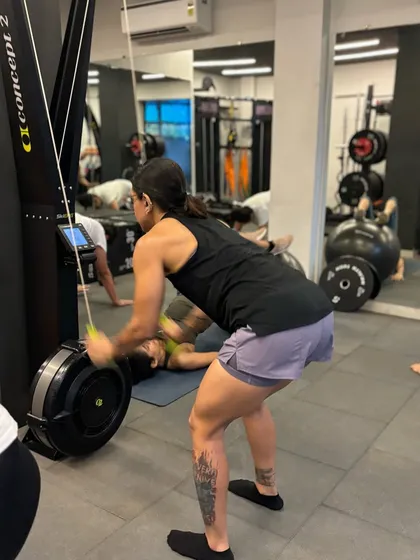 Using the rowing machine for a full-body cardio workout. It's a low-impact way to build strength and endurance simultaneously.