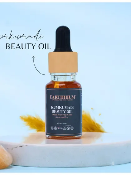 A clean shot of the Kumkumadi Beauty Oil, highlighting its natural, golden hue derived from pure saffron and herbs. It's a little bottle of glow for your daily skincare ritual.